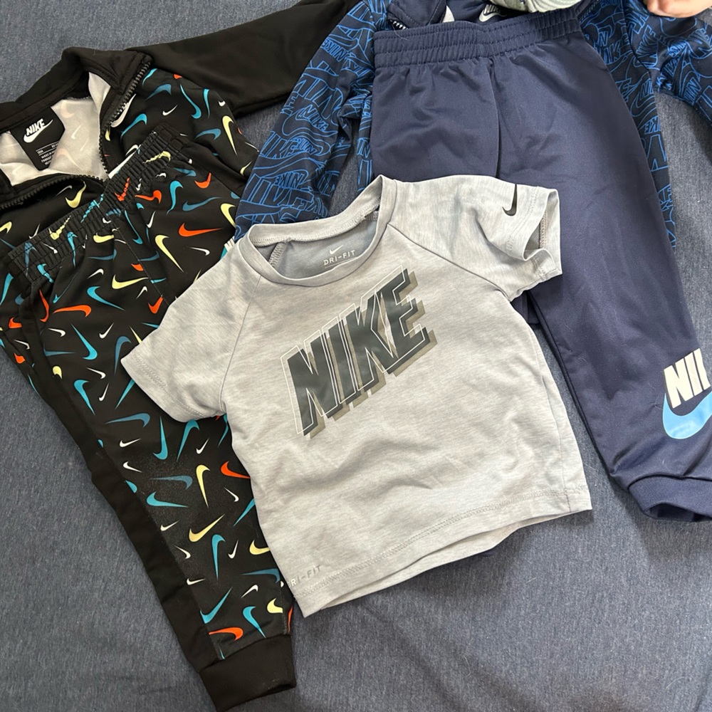 Two 12-18m Nike sweat suits and a 12-18m Nike tshirt